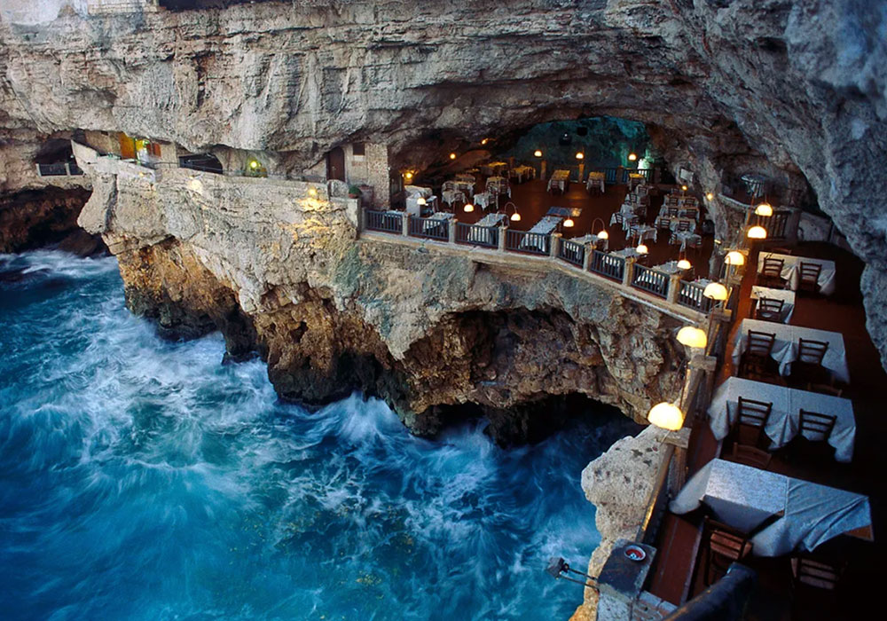 8 Unique Restaurants in Nature Around the World - Ristorante Grotta Palazzese – Puglia, Italy - Universal Logistics Universal & YOU Internal Newsletter