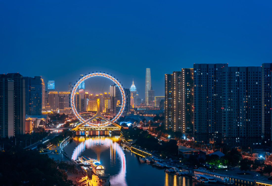 Name the city featuring a Ferris wheel built over a bridge - Global Spotlight Quiz - Route Newsletter: December 2024